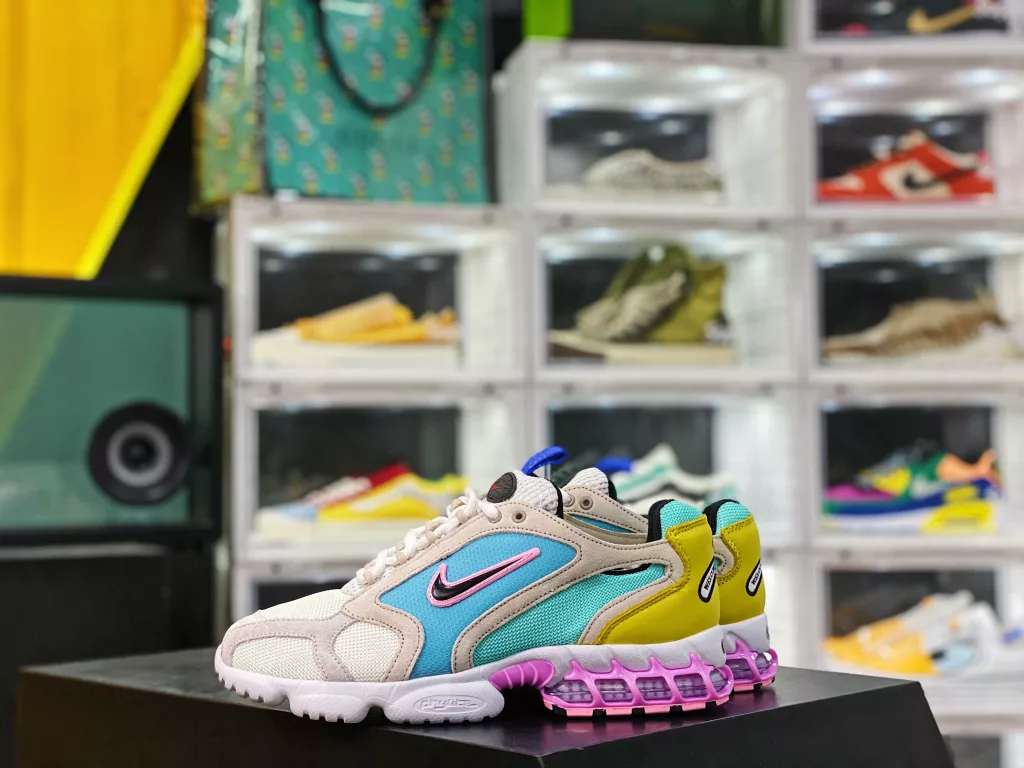 The Nike air Zoom Spiridon Cage Grey Blue Pink CW7482-100 Spiridon Cage 2 features an uncut millennial style, following the classic appearance from its inception in 2003