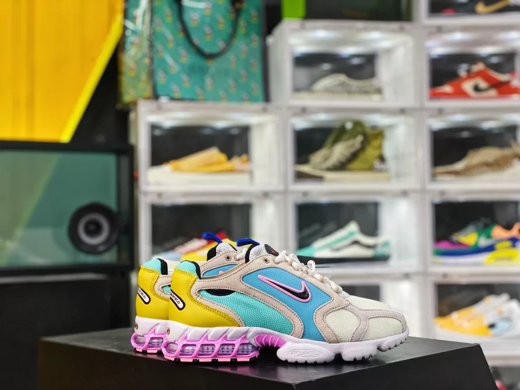 The Nike air Zoom Spiridon Cage Grey Blue Pink CW7482-100 Spiridon Cage 2 features an uncut millennial style, following the classic appearance from its inception in 2003