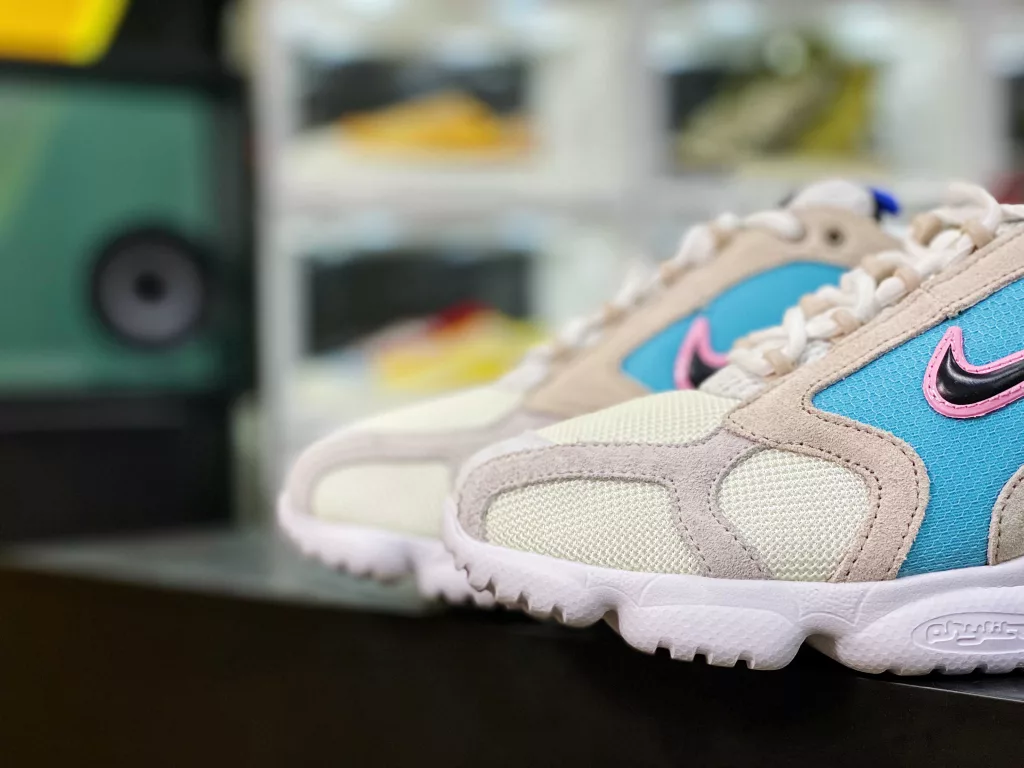 The Nike air Zoom Spiridon Cage Grey Blue Pink CW7482-100 Spiridon Cage 2 features an uncut millennial style, following the classic appearance from its inception in 2003