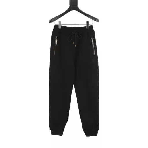 Louis Vuitton Pearl Drop SweatpantsTechnical Cotton Pearl Embellished SweatpantsThese stylish sweatpants from the Spring/Summer 2024 runway show are embellished with sophisticated details for a casual and sophisticated look. Made from midnight blue percale technical cotton, they feature side pockets with pearl-detailed zipper pulls and can be worn with a pearl-embellished hoodie.