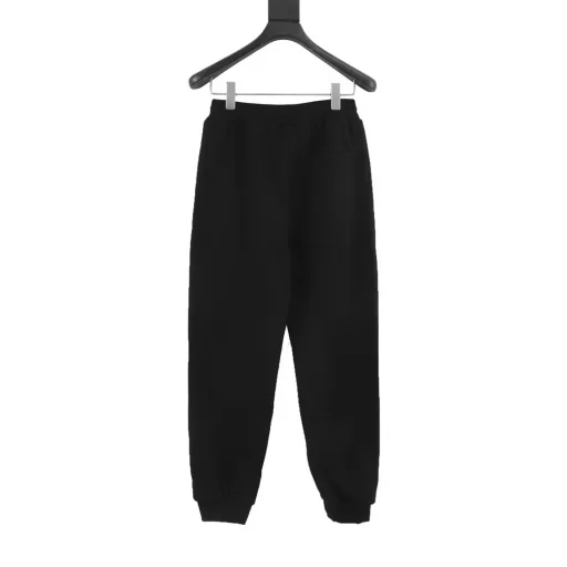 Louis Vuitton Pearl Drop SweatpantsTechnical Cotton Pearl Embellished SweatpantsThese stylish sweatpants from the Spring/Summer 2024 runway show are embellished with sophisticated details for a casual and sophisticated look. Made from midnight blue percale technical cotton, they feature side pockets with pearl-detailed zipper pulls and can be worn with a pearl-embellished hoodie.