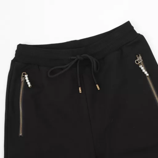 Louis Vuitton Pearl Drop SweatpantsTechnical Cotton Pearl Embellished SweatpantsThese stylish sweatpants from the Spring/Summer 2024 runway show are embellished with sophisticated details for a casual and sophisticated look. Made from midnight blue percale technical cotton, they feature side pockets with pearl-detailed zipper pulls and can be worn with a pearl-embellished hoodie.