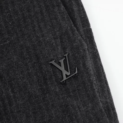Louis Vuitton & PARK SEO BO Cotton Velvet Set TrousersFrom the LV x Park Seo Bo collection, these sweatpants are a corduroy-effect jacquard with a horizontal weave, a nod to the artist's distinctive style. LV metal decorations are found on the left leg, and the pull on the zippered back pocket recalls the brand's leather goods heritage. Wear with the same top to create a trendy look.