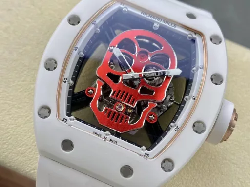 YS Richard Miller RM52-01 white ceramic limited edition real tourbillon reinterprets the essence of the RICHARD MILLE skull, breaking through the bugs of multiple versions, so that the majority of iron fans can have a super high replica with correct size, real movement and in-depth details. Reasons to buy:Size is similar: official length, width and thickness: 504316mm, YS factory length, width and thickness: 49.844.316.4mm;Real bearing: The ruby ​​in the skull's mouth is the real bearing of the tourbillon, not decoration. The gem corresponds to the tourbillon center axis wrapped by the upper and lower jaws, as if swallowing an energy ball, so that the sci-fi artistic conception that the original wants to express can be reflected;Details are in place: The inner wall on the left side of the case inner cover is printed with the RM052 steel stamp like the original, and the size and depth of the right eye gear are close to the original , the center gemstone on the forehead is ruddy and translucent, frosted clasp, imported Thai raw rubber strap;Movement alignment: Thanks to the consistent size of the tourbillon and the original one, from the back of the skull, you can clearly see the operation of the tourbillon with the gemstone coaxial. From the front, the black balance wheel is just blocked by the skull's jaw, leaving only the escape wheel to move under the skull;Inside and outside: The movement is a real tourbillon movement customized by Shanghai Movement Factory. Each watch is QE-edged by a high-intensity simulator, and it is also waterproof.YS Factory——Use the core more carefully!
