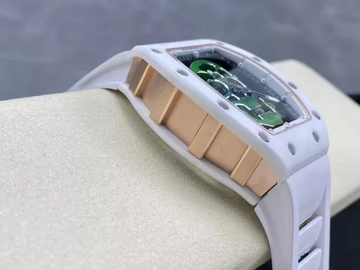 YS Richard Miller RM52-01 white ceramic limited edition real tourbillon reinterprets the essence of the RICHARD MILLE skull, breaking through the bugs of multiple versions, so that the majority of iron fans can have a super high replica with correct size, real movement and in-depth details. Reasons to buy:Size is similar: official length, width and thickness: 504316mm, YS factory length, width and thickness: 49.844.316.4mm;Real bearing: The ruby ​​in the skull's mouth is the real bearing of the tourbillon, not decoration. The gem corresponds to the tourbillon center axis wrapped by the upper and lower jaws, as if swallowing an energy ball, so that the sci-fi artistic conception that the original wants to express can be reflected;Details are in place: The inner wall on the left side of the case inner cover is printed with the RM052 steel stamp like the original, and the size and depth of the right eye gear are close to the original , the center gemstone on the forehead is ruddy and translucent, frosted clasp, imported Thai raw rubber strap;Movement alignment: Thanks to the consistent size of the tourbillon and the original one, from the back of the skull, you can clearly see the operation of the tourbillon with the gemstone coaxial. From the front, the black balance wheel is just blocked by the skull's jaw, leaving only the escape wheel to move under the skull;Inside and outside: The movement is a real tourbillon movement customized by Shanghai Movement Factory. Each watch is QE-edged by a high-intensity simulator, and it is also waterproof.YS Factory——Use the core more carefully!