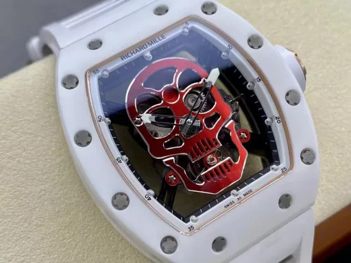 YS Richard Miller RM52-01 white ceramic limited edition real tourbillon reinterprets the essence of the RICHARD MILLE skull, breaking through the bugs of multiple versions, so that the majority of iron fans can have a super high replica with correct size, real movement and in-depth details. Reasons to buy:Size is similar: official length, width and thickness: 504316mm, YS factory length, width and thickness: 49.844.316.4mm;Real bearing: The ruby ​​in the skull's mouth is the real bearing of the tourbillon, not decoration. The gem corresponds to the tourbillon center axis wrapped by the upper and lower jaws, as if swallowing an energy ball, so that the sci-fi artistic conception that the original wants to express can be reflected;Details are in place: The inner wall on the left side of the case inner cover is printed with the RM052 steel stamp like the original, and the size and depth of the right eye gear are close to the original , the center gemstone on the forehead is ruddy and translucent, frosted clasp, imported Thai raw rubber strap;Movement alignment: Thanks to the consistent size of the tourbillon and the original one, from the back of the skull, you can clearly see the operation of the tourbillon with the gemstone coaxial. From the front, the black balance wheel is just blocked by the skull's jaw, leaving only the escape wheel to move under the skull;Inside and outside: The movement is a real tourbillon movement customized by Shanghai Movement Factory. Each watch is QE-edged by a high-intensity simulator, and it is also waterproof.YS Factory——Use the core more carefully!