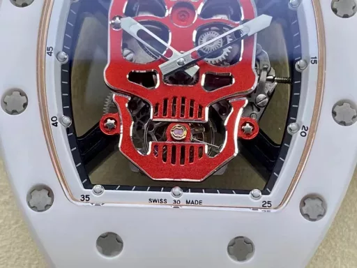 YS Richard Miller RM52-01 white ceramic limited edition real tourbillon reinterprets the essence of the RICHARD MILLE skull, breaking through the bugs of multiple versions, so that the majority of iron fans can have a super high replica with correct size, real movement and in-depth details. Reasons to buy:Size is similar: official length, width and thickness: 504316mm, YS factory length, width and thickness: 49.844.316.4mm;Real bearing: The ruby ​​in the skull's mouth is the real bearing of the tourbillon, not decoration. The gem corresponds to the tourbillon center axis wrapped by the upper and lower jaws, as if swallowing an energy ball, so that the sci-fi artistic conception that the original wants to express can be reflected;Details are in place: The inner wall on the left side of the case inner cover is printed with the RM052 steel stamp like the original, and the size and depth of the right eye gear are close to the original , the center gemstone on the forehead is ruddy and translucent, frosted clasp, imported Thai raw rubber strap;Movement alignment: Thanks to the consistent size of the tourbillon and the original one, from the back of the skull, you can clearly see the operation of the tourbillon with the gemstone coaxial. From the front, the black balance wheel is just blocked by the skull's jaw, leaving only the escape wheel to move under the skull;Inside and outside: The movement is a real tourbillon movement customized by Shanghai Movement Factory. Each watch is QE-edged by a high-intensity simulator, and it is also waterproof.YS Factory——Use the core more carefully!