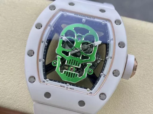 YS Richard Miller RM52-01 white ceramic limited edition real tourbillon reinterprets the essence of the RICHARD MILLE skull, breaking through the bugs of multiple versions, so that the majority of iron fans can have a super high replica with correct size, real movement and in-depth details. Reasons to buy:Size is similar: official length, width and thickness: 504316mm, YS factory length, width and thickness: 49.844.316.4mm;Real bearing: The ruby ​​in the skull's mouth is the real bearing of the tourbillon, not decoration. The gem corresponds to the tourbillon center axis wrapped by the upper and lower jaws, as if swallowing an energy ball, so that the sci-fi artistic conception that the original wants to express can be reflected;Details are in place: The inner wall on the left side of the case inner cover is printed with the RM052 steel stamp like the original, and the size and depth of the right eye gear are close to the original , the center gemstone on the forehead is ruddy and translucent, frosted clasp, imported Thai raw rubber strap;Movement alignment: Thanks to the consistent size of the tourbillon and the original one, from the back of the skull, you can clearly see the operation of the tourbillon with the gemstone coaxial. From the front, the black balance wheel is just blocked by the skull's jaw, leaving only the escape wheel to move under the skull;Inside and outside: The movement is a real tourbillon movement customized by Shanghai Movement Factory. Each watch is QE-edged by a high-intensity simulator, and it is also waterproof.YS Factory——Use the core more carefully!