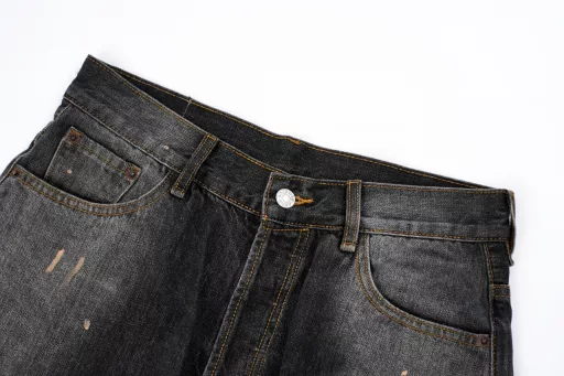 ACNE splashed ink painted button-up jean shortsThe use of tannin fabric imported from Japan is characterized by high densityThe yarn is thick and therefore has strong wear resistance and tensile strengthSuitable to withstand everyday use and activity wear at the same timeIt also has softness over time and with frequent wear,The tannin fabric will gradually become soft and fit the bodyAfter special dyeing and finishing proceduresThe tannin fabric also has good color fastness and washable resistanceIt can withstand multiple washes without fading easilyHand-painted splash-ink designIt takes up to 30 minutes to paint a finished productThe daily production is limited and the work process is very tediousAfter painting, wash water and old treatmentIt is an important process to make denim fabric show the retro and old effectShowing a natural uneven fading effectCustom leather label details in the back pocket with a pink threadPerfect reproduction details men and women alike