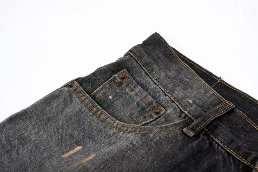 ACNE splashed ink painted button-up jean shortsThe use of tannin fabric imported from Japan is characterized by high densityThe yarn is thick and therefore has strong wear resistance and tensile strengthSuitable to withstand everyday use and activity wear at the same timeIt also has softness over time and with frequent wear,The tannin fabric will gradually become soft and fit the bodyAfter special dyeing and finishing proceduresThe tannin fabric also has good color fastness and washable resistanceIt can withstand multiple washes without fading easilyHand-painted splash-ink designIt takes up to 30 minutes to paint a finished productThe daily production is limited and the work process is very tediousAfter painting, wash water and old treatmentIt is an important process to make denim fabric show the retro and old effectShowing a natural uneven fading effectCustom leather label details in the back pocket with a pink threadPerfect reproduction details men and women alike