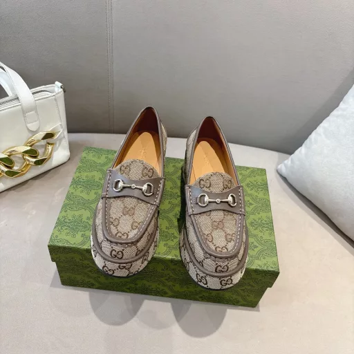 ucci new women's wedge loafers horsebit moccasin Original GG fabric sets this sophisticated horsebit moccasin apart. Black cowhide light gold metal details. The wedge heel brings an original and impactful touch to this iconic style
