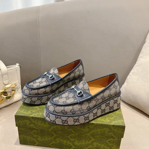 ucci new women's wedge loafers horsebit moccasin Original GG fabric sets this sophisticated horsebit moccasin apart. Black cowhide light gold metal details. The wedge heel brings an original and impactful touch to this iconic style
