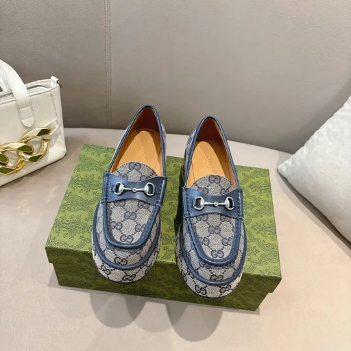 ucci new women's wedge loafers horsebit moccasin Original GG fabric sets this sophisticated horsebit moccasin apart. Black cowhide light gold metal details. The wedge heel brings an original and impactful touch to this iconic style