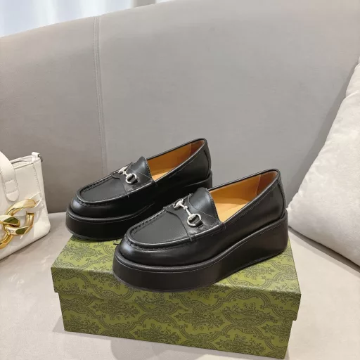 ucci new women's wedge loafers horsebit moccasin Original GG fabric sets this sophisticated horsebit moccasin apart. Black cowhide light gold metal details. The wedge heel brings an original and impactful touch to this iconic style
