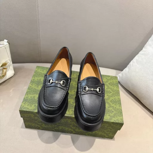 ucci new women's wedge loafers horsebit moccasin Original GG fabric sets this sophisticated horsebit moccasin apart. Black cowhide light gold metal details. The wedge heel brings an original and impactful touch to this iconic style