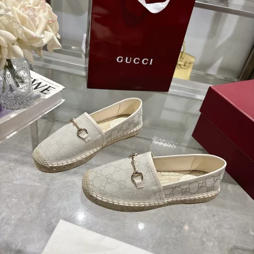 Horsebit Women's New Fisherman ShoesCrafted in off-white GG canvas, these shoes combine traditional patterns with modern style. The light gold horsebit detail adds a touch of sophistication, while the cotton, linen and rubber sole ensures comfort and stability.
