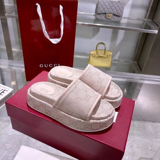 2025 Women's New GG Platform Slide SandalsThe iconic Gucci logo and sophisticated patterns are reinterpreted in a contemporary way for the latest Gucci collection. Made from GG canvas, these wedge-shaped slide sandals feature an iconic silhouette.Original GG canvas in beige and light apricot