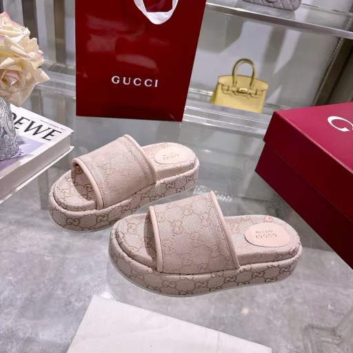 2025 Women's New GG Platform Slide SandalsThe iconic Gucci logo and sophisticated patterns are reinterpreted in a contemporary way for the latest Gucci collection. Made from GG canvas, these wedge-shaped slide sandals feature an iconic silhouette.Original GG canvas in beige and light apricot