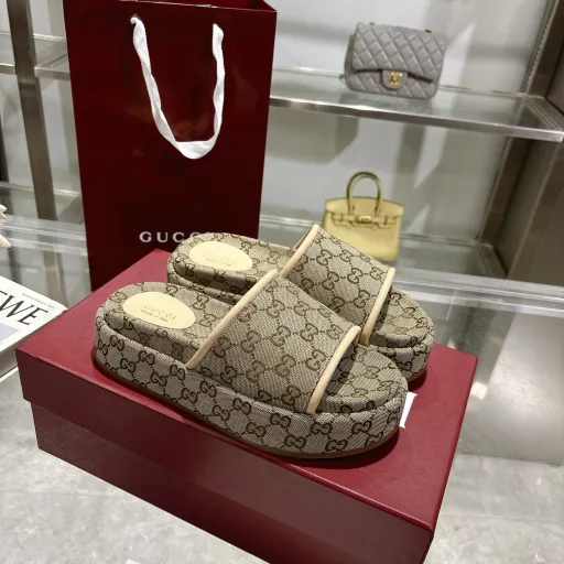 2025 Women's New GG Platform Slide SandalsThe iconic Gucci logo and sophisticated patterns are reinterpreted in a contemporary way for the latest Gucci collection. Made from GG canvas, these wedge-shaped slide sandals feature an iconic silhouette.Original GG canvas in beige and light apricot