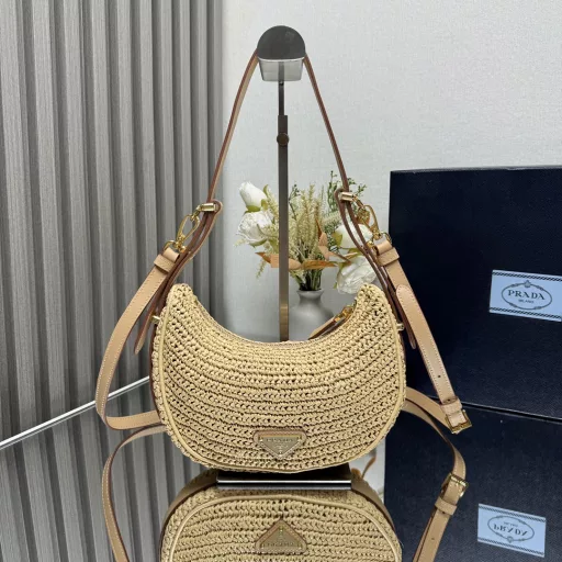 New Woven Moon Bag: Featuring a curvaceous half-moon silhouette, the raffia fabric gives it structure and uniqueness. Reinterpreted with a more refined design, full of summer mood, cleverly adding details such as handles and detachable shoulder straps, it can be worn in a variety of styles