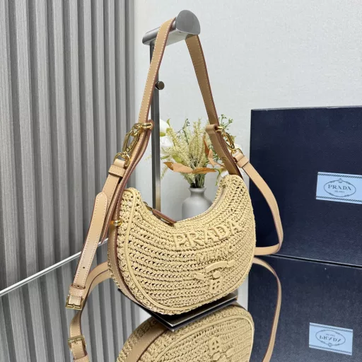 New Woven Moon Bag: Featuring a curvaceous half-moon silhouette, the raffia fabric gives it structure and uniqueness. Reinterpreted with a more refined design, full of summer mood, cleverly adding details such as handles and detachable shoulder straps, it can be worn in a variety of styles