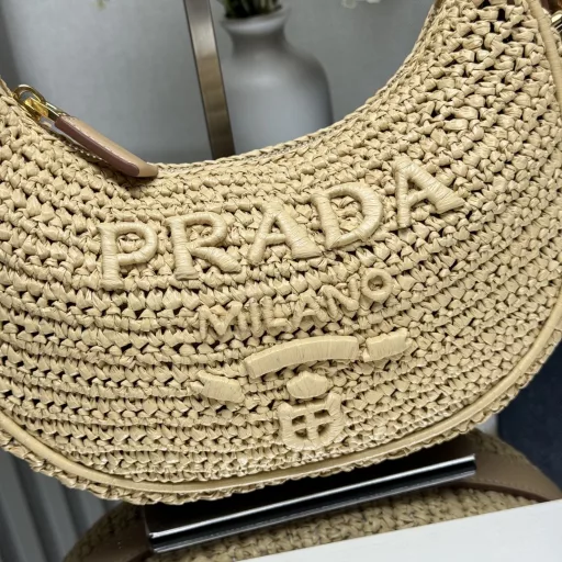 New Woven Moon Bag: Featuring a curvaceous half-moon silhouette, the raffia fabric gives it structure and uniqueness. Reinterpreted with a more refined design, full of summer mood, cleverly adding details such as handles and detachable shoulder straps, it can be worn in a variety of styles