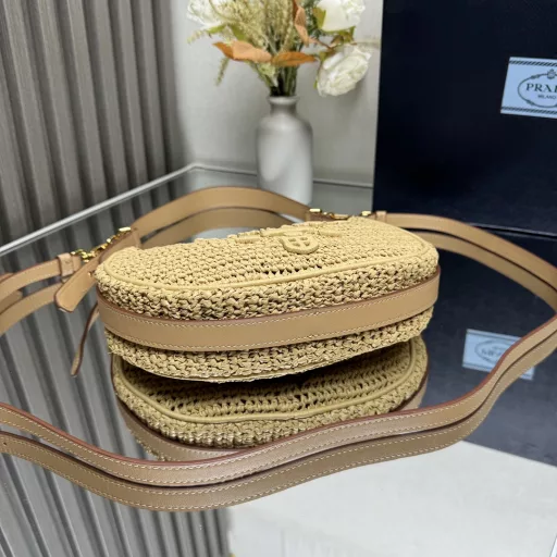 New Woven Moon Bag: Featuring a curvaceous half-moon silhouette, the raffia fabric gives it structure and uniqueness. Reinterpreted with a more refined design, full of summer mood, cleverly adding details such as handles and detachable shoulder straps, it can be worn in a variety of styles