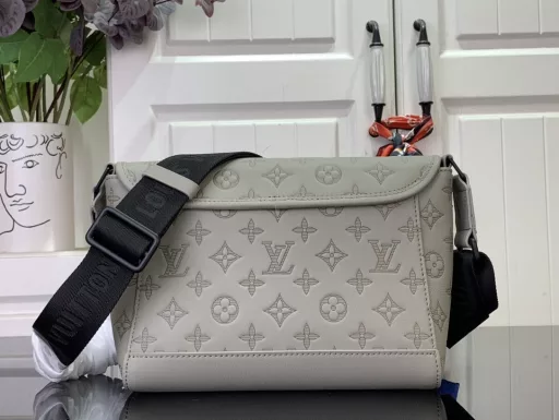 The sporty silhouette is enhanced with Monogram Shadow embossed leather and sophisticated hardware, and the flap is decorated with zipper pockets above and below. The adjustable fabric shoulder strap allows for shoulder or crossbody carry.