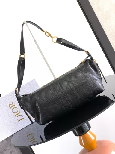 New this season, the D-Journey bag made its debut at the Dior Spring/Summer 2025 ready-to-wear show. It's soft and modern, with a modern take on the dumpling bag silhouette. Crafted from white crinkled calfskin leather, it's decorated with flat, oversized rattan stitching, a new take on Dior's classic motif. The main compartment features a zippered pocket for added refinement, and two decorative side pockets with large leather zipper pulls embellished with the Christian Dior Paris logo. The medium size, with an adjustable top leather handle and leather shoulder strap, can be carried by hand, on the shoulder or across the body, making it an ideal companion for everyday styling