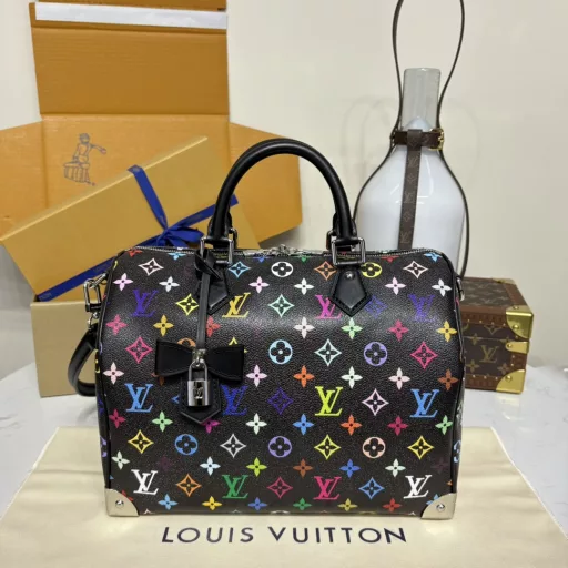 The Speedy Soft 30 is crafted from soft coated canvas with a rainbow-hued Monogram pattern, a nod to the x Takashi Murakami re-edition. Calf leather makes the Toron handles and removable shoulder strap, while metal corners recall classic luggage elements, while a bow-shaped key case and padlock add a brand touch.