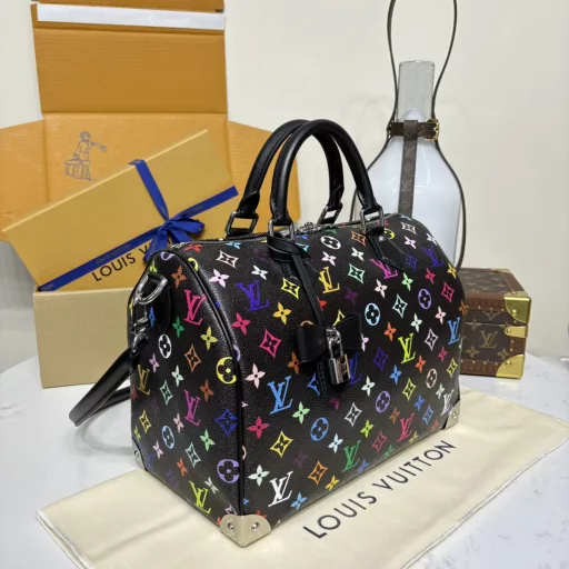 The Speedy Soft 30 is crafted from soft coated canvas with a rainbow-hued Monogram pattern, a nod to the x Takashi Murakami re-edition. Calf leather makes the Toron handles and removable shoulder strap, while metal corners recall classic luggage elements, while a bow-shaped key case and padlock add a brand touch.