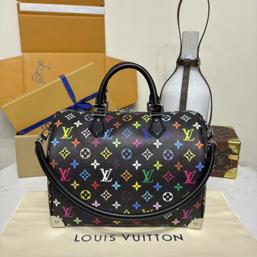 The Speedy Soft 30 is crafted from soft coated canvas with a rainbow-hued Monogram pattern, a nod to the x Takashi Murakami re-edition. Calf leather makes the Toron handles and removable shoulder strap, while metal corners recall classic luggage elements, while a bow-shaped key case and padlock add a brand touch.