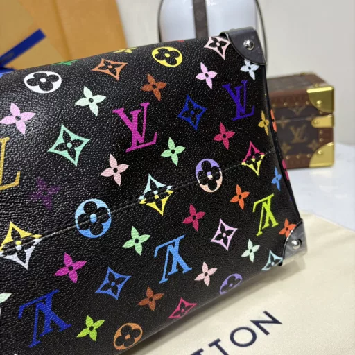 The Speedy Soft 30 is crafted from soft coated canvas with a rainbow-hued Monogram pattern, a nod to the x Takashi Murakami re-edition. Calf leather makes the Toron handles and removable shoulder strap, while metal corners recall classic luggage elements, while a bow-shaped key case and padlock add a brand touch.