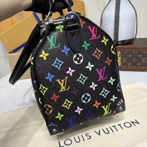 The Speedy Soft 30 is crafted from soft coated canvas with a rainbow-hued Monogram pattern, a nod to the x Takashi Murakami re-edition. Calf leather makes the Toron handles and removable shoulder strap, while metal corners recall classic luggage elements, while a bow-shaped key case and padlock add a brand touch.