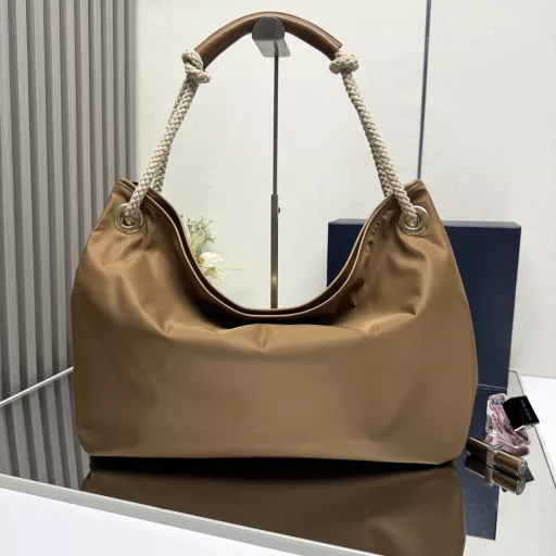 New Tote Bag 🎉1BC244 Large Shopping Bag🎉🎉This recycled nylon bag is inspired by classic marine elements, with a novel and exquisite combination to highlight a lively and individual style. The sliding braided handle outlines the oversized silhouette of this versatile accessory, and the enameled triangular metal logo highlights the brand identity. It has a large capacity and the upper body effect is very charming😘😘Lightweight and practical, it is another timeless hit