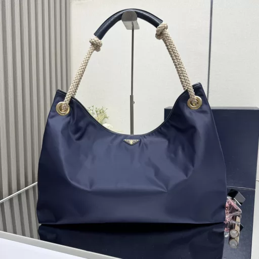 New Tote Bag 🎉1BC244 Large Shopping Bag🎉🎉This recycled nylon bag is inspired by classic marine elements, with a novel and exquisite combination to highlight a lively and individual style. The sliding braided handle outlines the oversized silhouette of this versatile accessory, and the enameled triangular metal logo highlights the brand identity. It has a large capacity and the upper body effect is very charming😘😘Lightweight and practical, it is another timeless hit