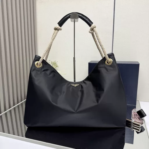 New Tote Bag 🎉1BC244 Large Shopping Bag🎉🎉This recycled nylon bag is inspired by classic marine elements, with a novel and exquisite combination to highlight a lively and individual style. The sliding braided handle outlines the oversized silhouette of this versatile accessory, and the enameled triangular metal logo highlights the brand identity. It has a large capacity and the upper body effect is very charming😘😘Lightweight and practical, it is another timeless hit