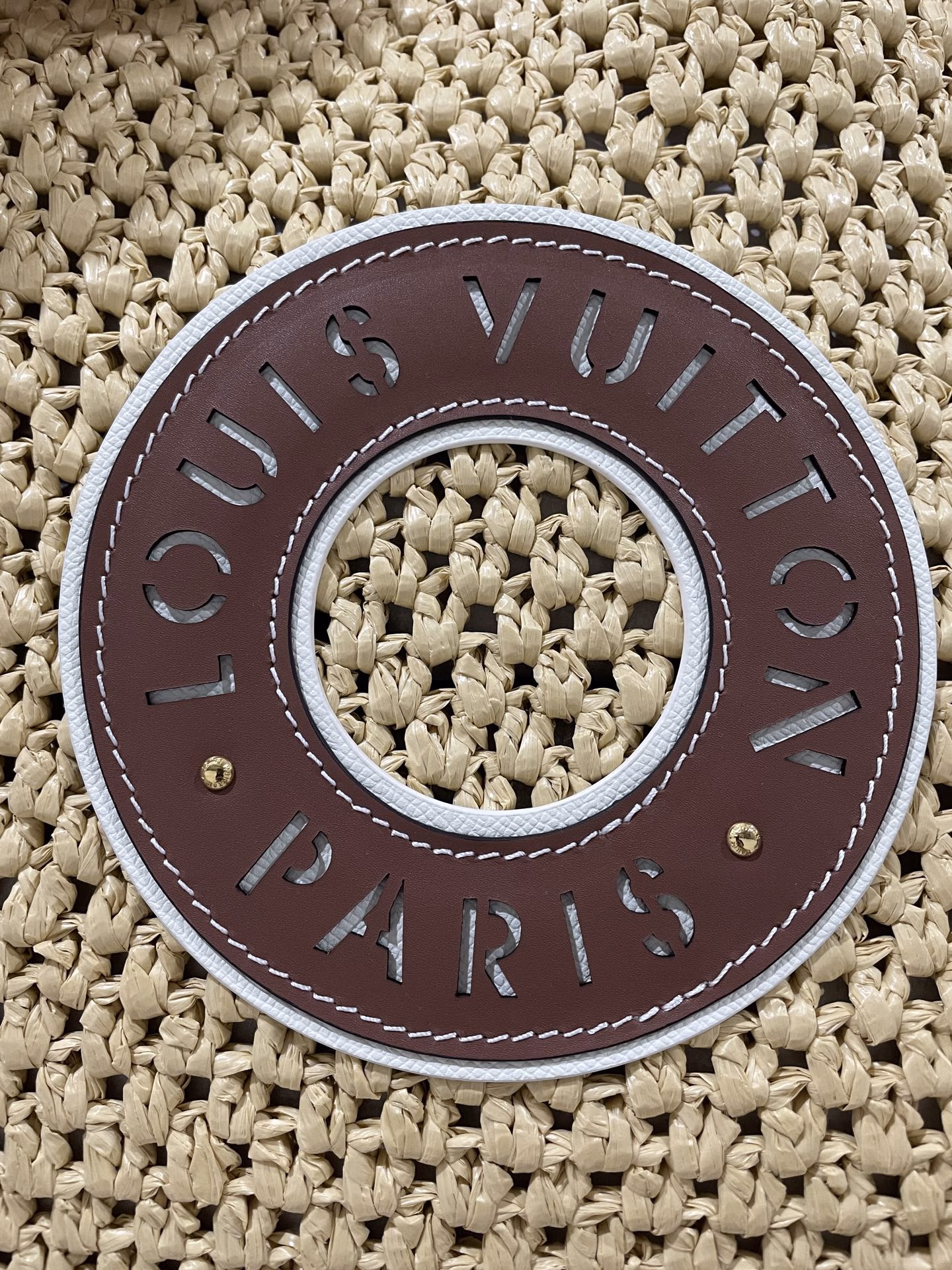 From the LV By The Pool collection, the OnTheGo Medium is crafted in crocheted raffia in a tote shape to accommodate everything from a 13