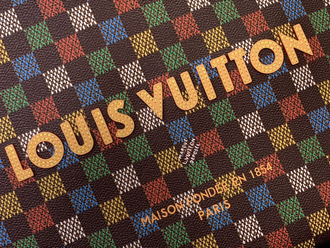 The Shopper Tote is inspired by the classic Louis Vuitton shopping bag, featuring the same clean lines and contrasting Louis Vuitton monogram. This bag is made of LVers Damier Ebene coated canvas with Pharrell Williams' colorful reinterpretation of the Damier pattern (inspired by the classic design created by Georges Vuitton in 1888). Two top handles and a removable shoulder strap provide flexible carrying options, combining practicality and unique charm.