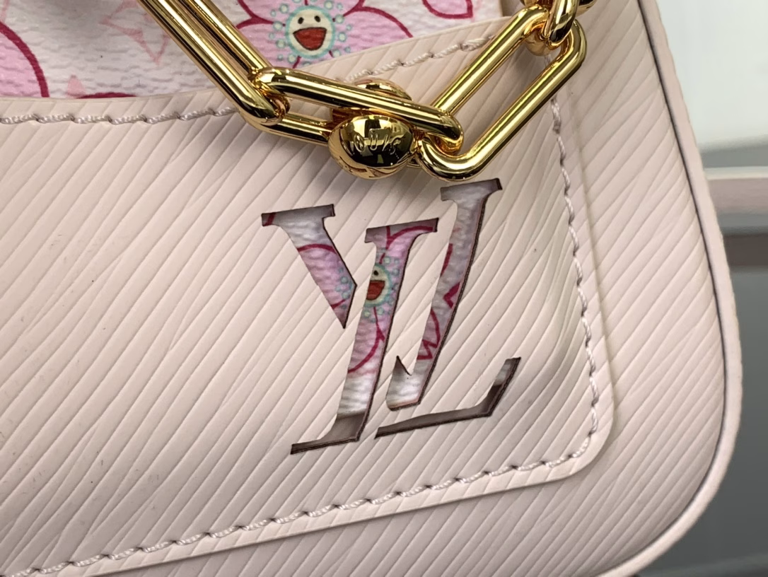 Cherry Blossom Water Ripple Underarm Bag New LV x TM MARELLINI Handbag of the Season This Marellini handbag is made of Epi grain leather with dazzling metal parts, showing the vitality of the Louis Vuitton x Takashi Murakami replica series. The detachable mirror depicts the Cherry Blossom pattern on the Monogram canvas, which reflects the personality of the Cherry Blossom bag decoration.